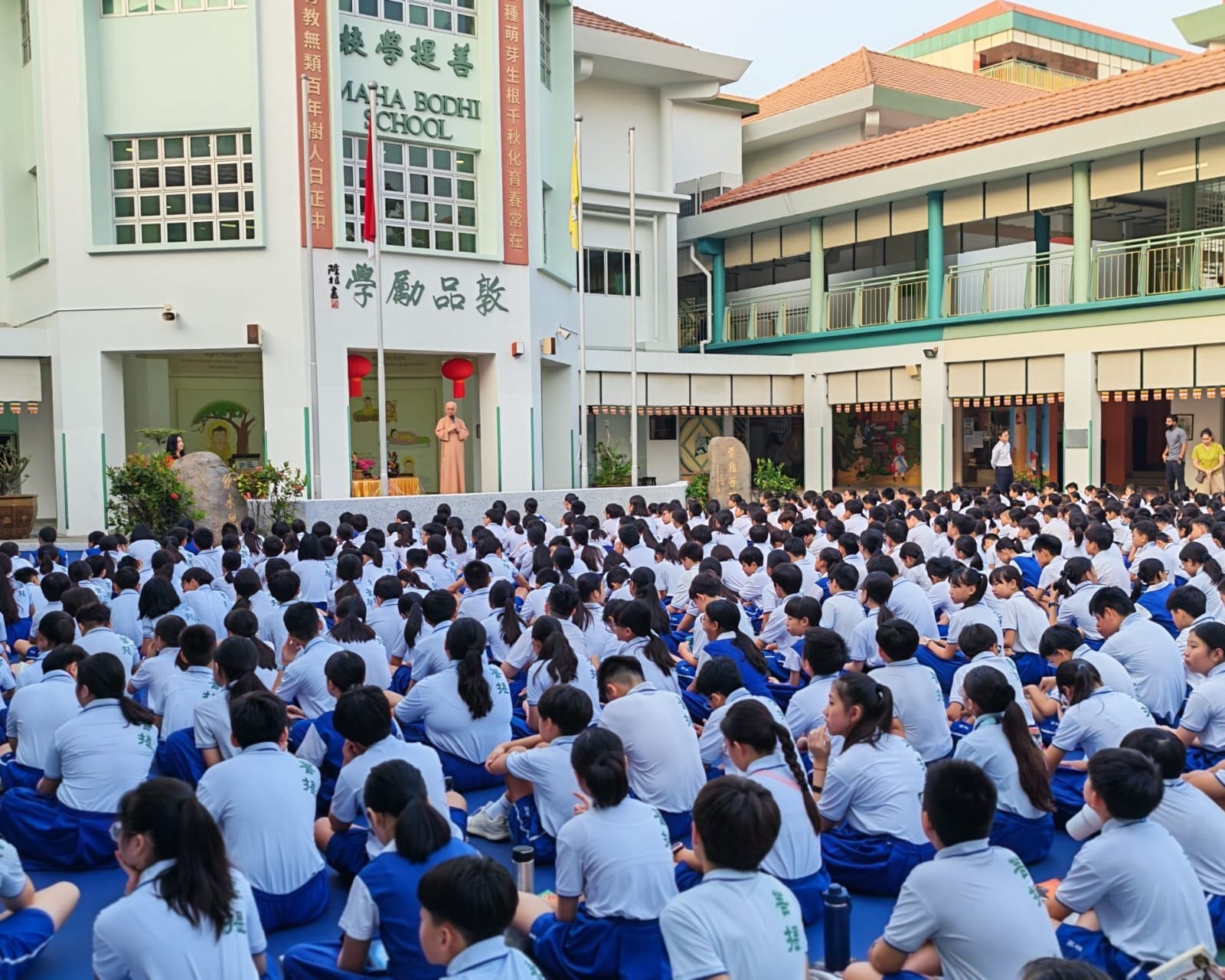Pupils listening attentively to Dharma sharing by Venerable Kwang Phing. 